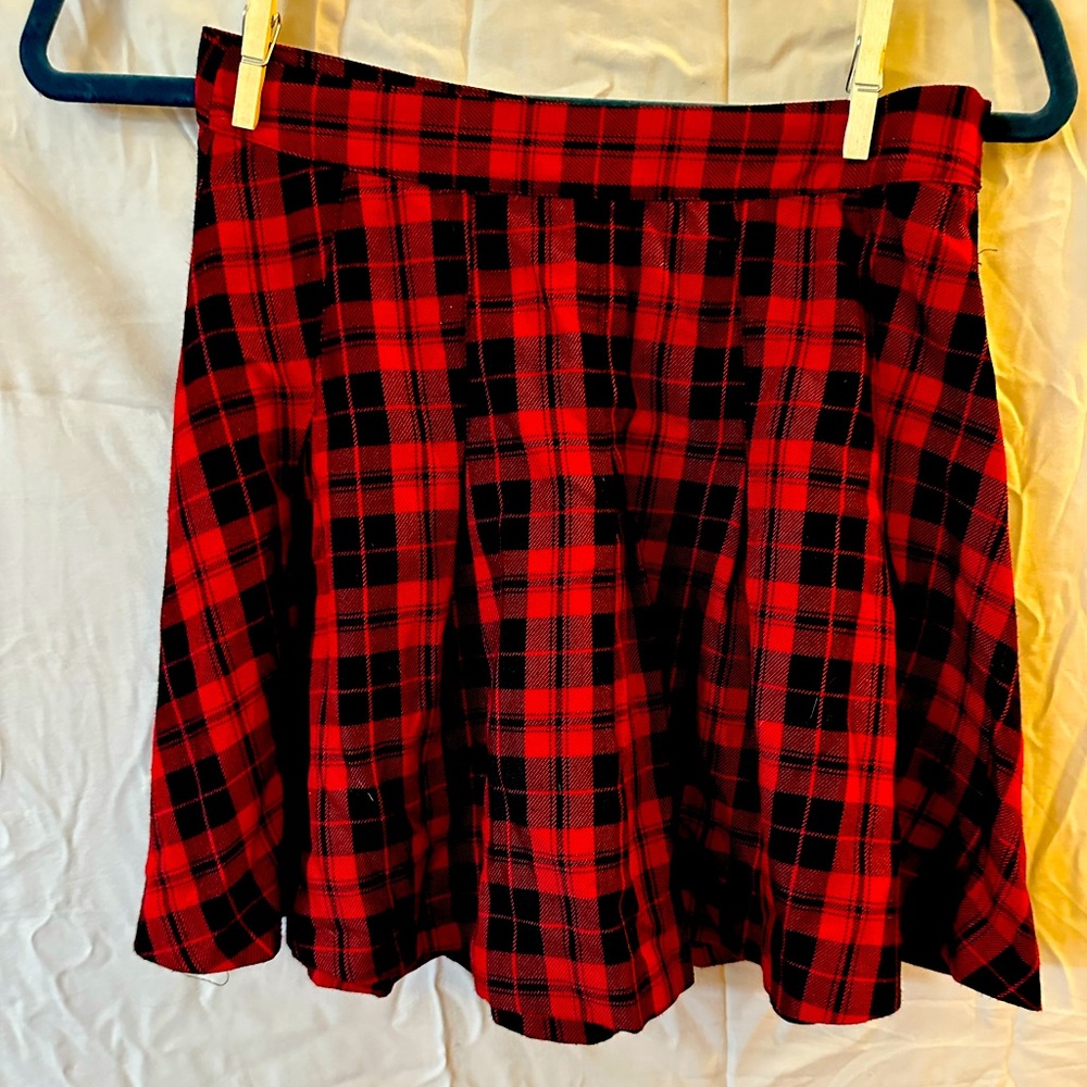 Gently used red pleated plaid skirt